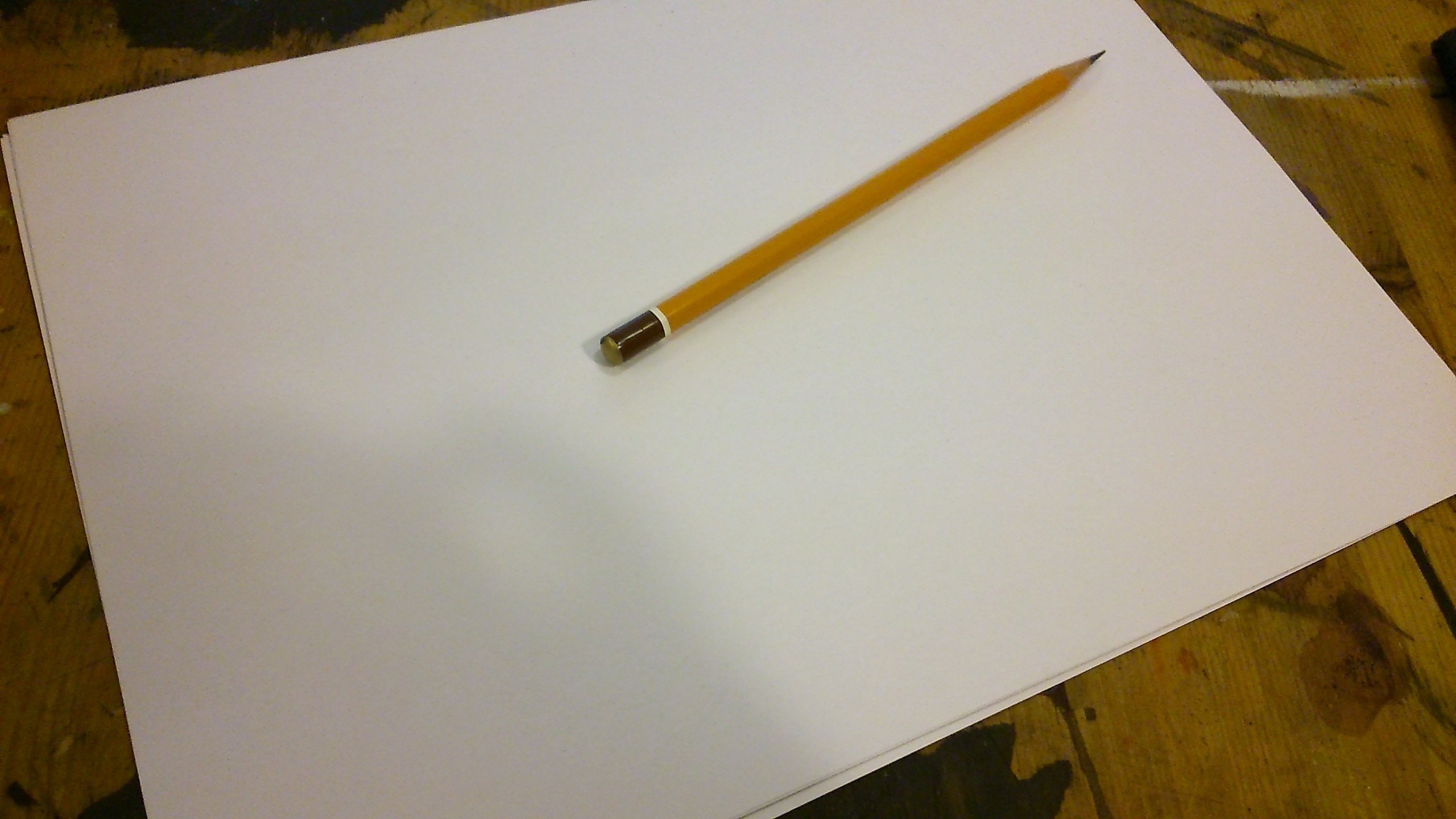 Белый лист бумаги на столе. Бумага и карандаш. Рисование листьями. Огромный лист бумаги для рисования. Лист бумаги и карандаш.