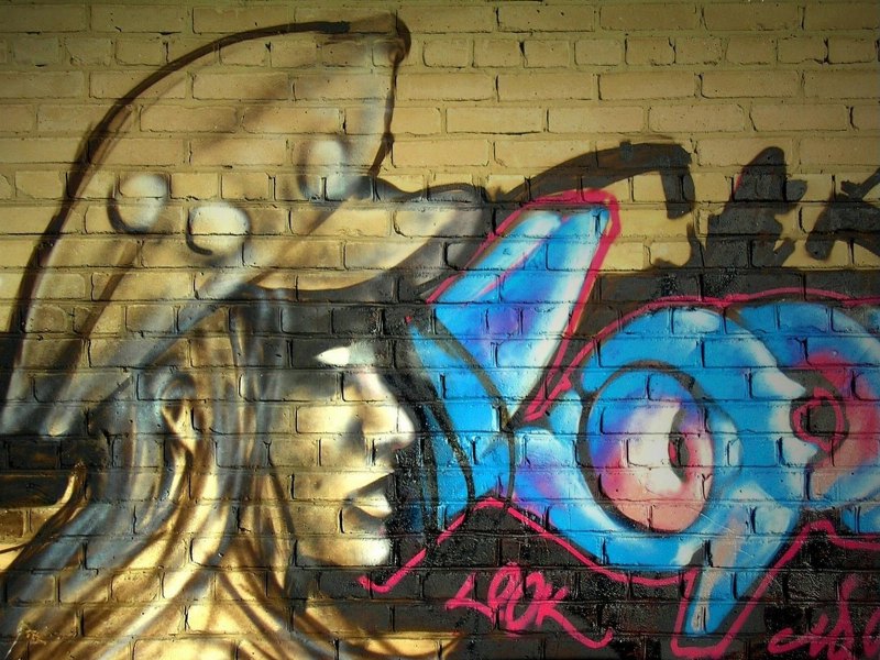 Граффити выцарапанное на стене